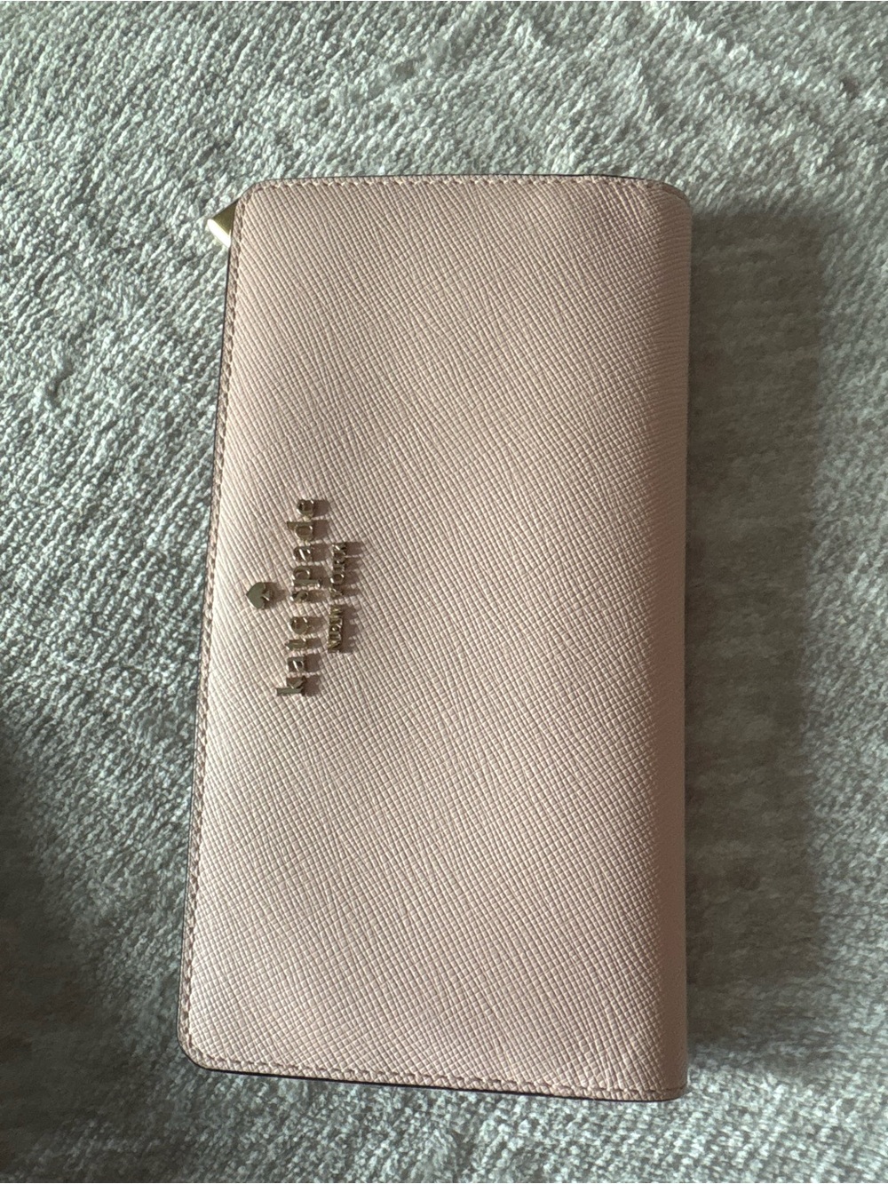 kate spade pale pink saffiano zip-around wallet with gold logo